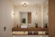 Modernes Badezimmer mit Holzwaschtisch und drei klaren Glasleuchten für warme LED-Beleuchtung
