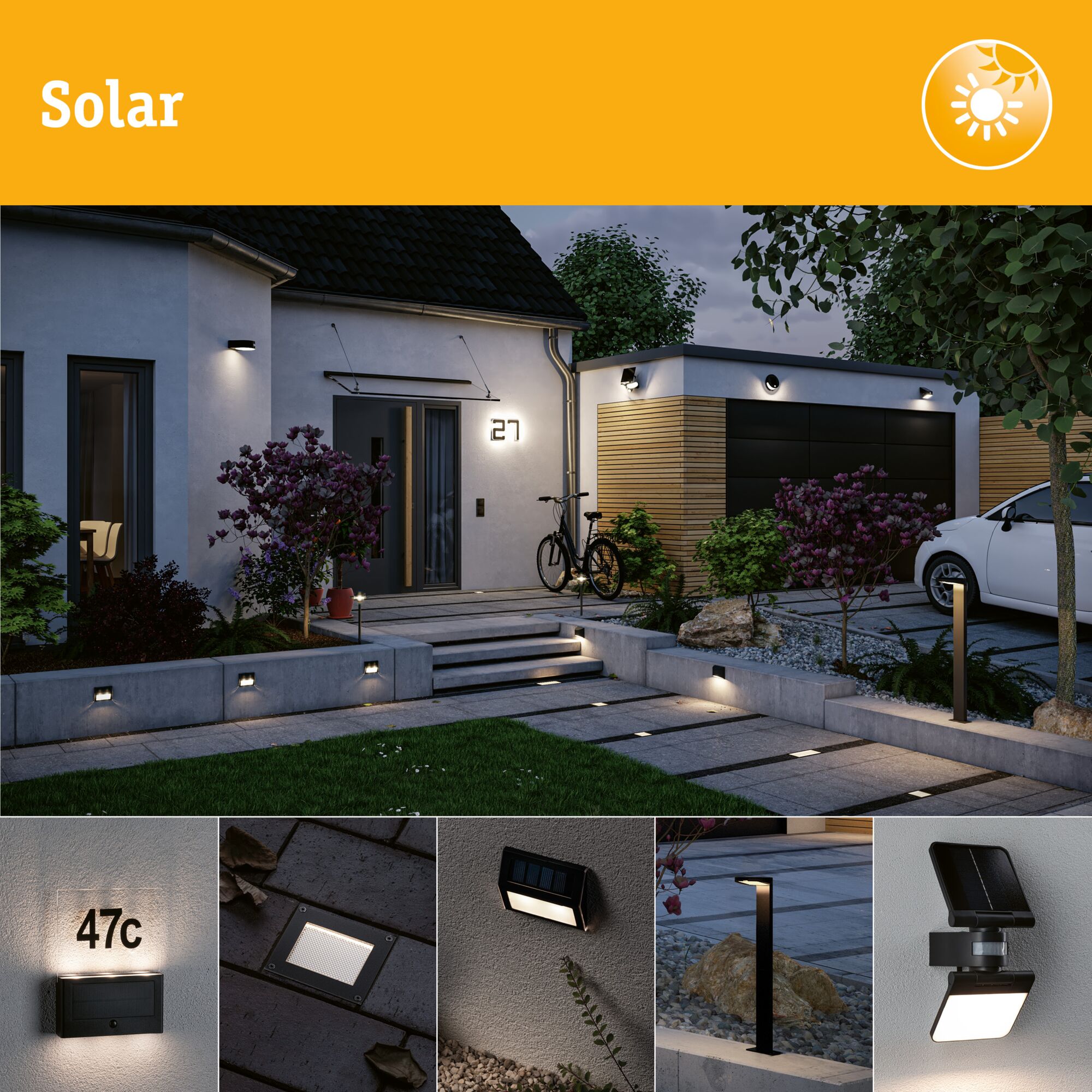 Black solar outdoor lights on house and garden path for energy-saving illumination