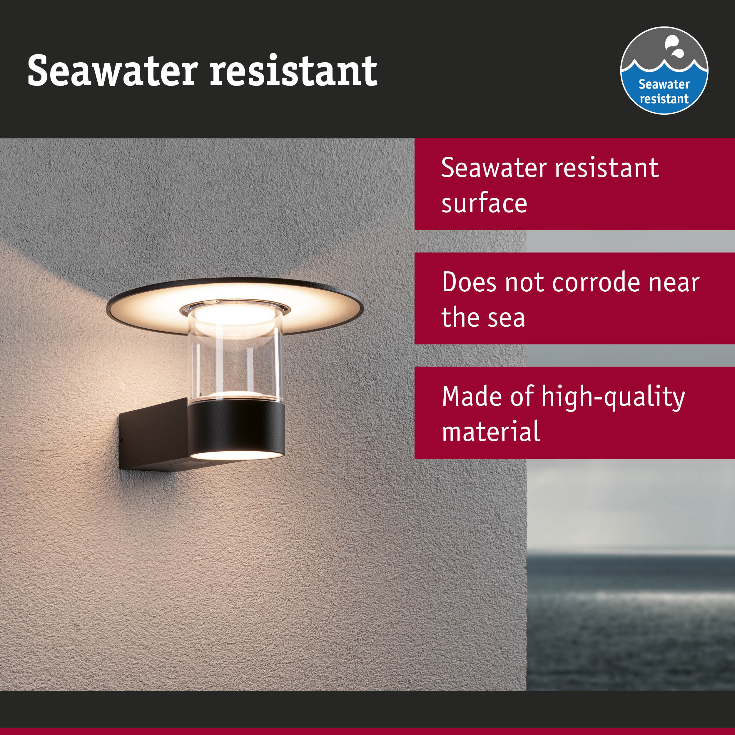 Black outdoor wall light with glass and seawater resistant surface ideal for coastal lighting