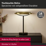 Moderne Tischleuchte Melira mit goldenem Ring und schwarzem Metallfuß, dimmbar in 3 Stufen