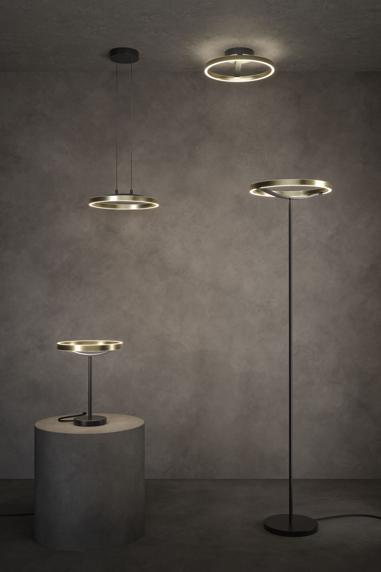 Modern black and brass LED ring lights as ceiling, table, and floor lamps in a minimalist room.