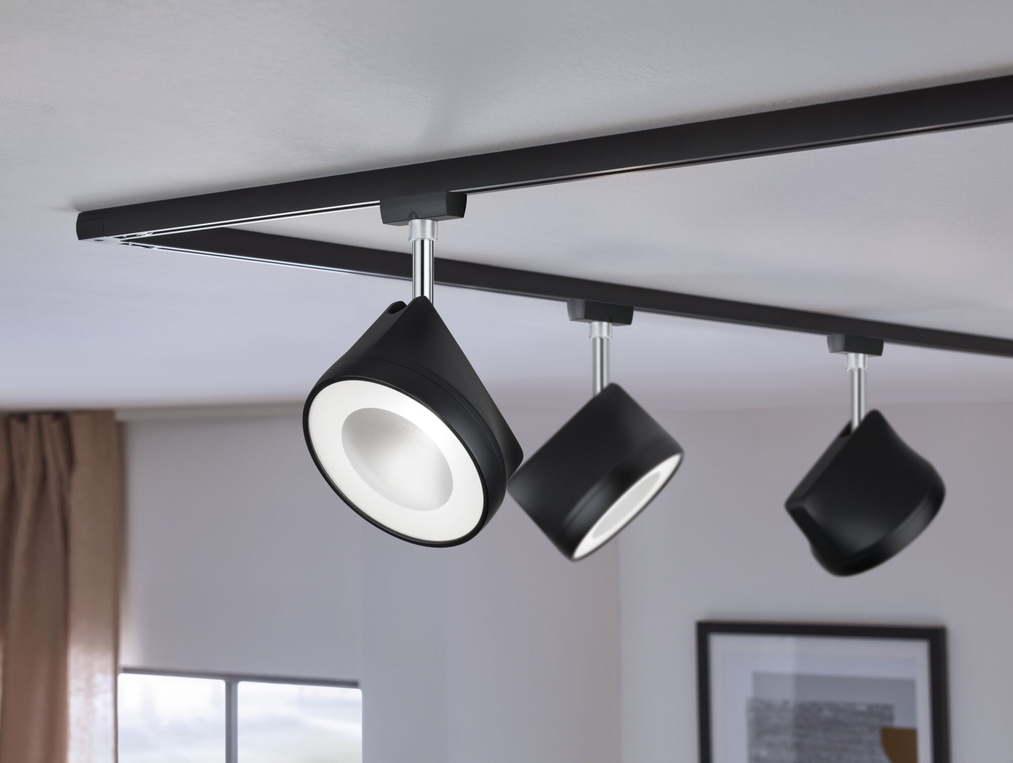 Black metal LED track lighting with three adjustable spotlights for modern interior illumination