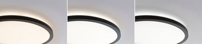Three round ceiling lights with black metal frame and warm white LED light on white ceiling.