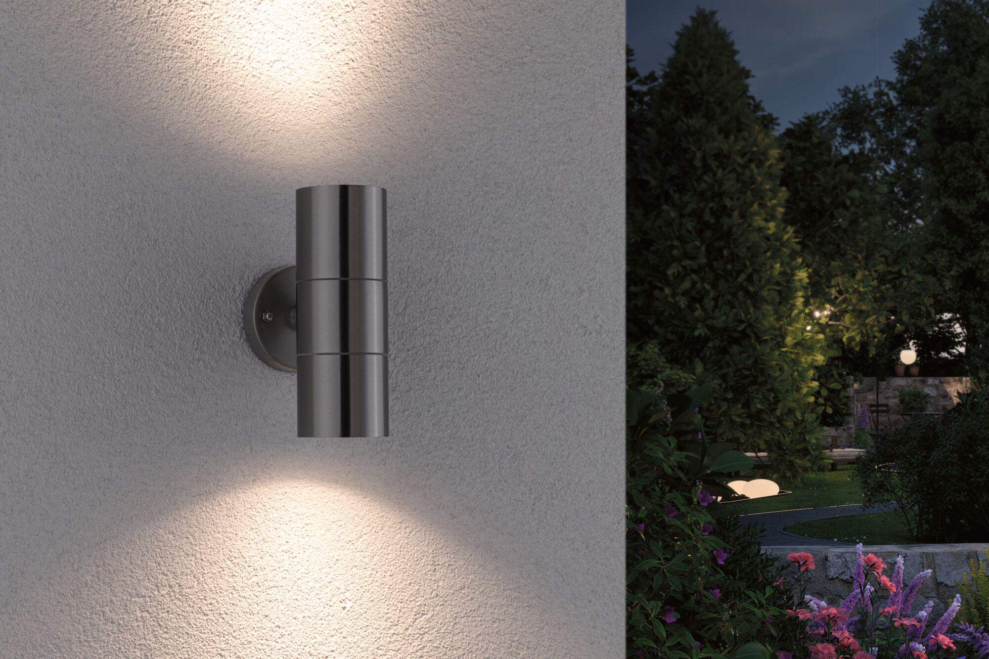 Modern stainless steel wall light with up and down illumination for outdoor and garden lighting.