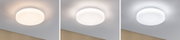 Three white round LED ceiling lights showing different light colors on white ceiling.