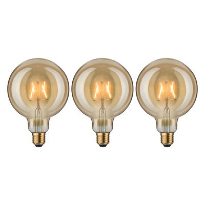 Three round LED bulbs with amber glass and visible filament for decorative lighting effects