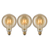 Three round LED bulbs with amber glass and visible filament for decorative lighting effects