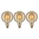 Three round LED bulbs with amber glass and visible filament for decorative lighting effects