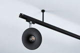 Black metal LED ceiling light with round reflector and adjustable spotlight for modern interior lighting