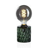 Table lamp with green glass base and large bulb featuring decorative LED filament for ambient lighting
