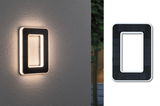 Rectangular black solar wall light with warm white LED illumination for outdoor use