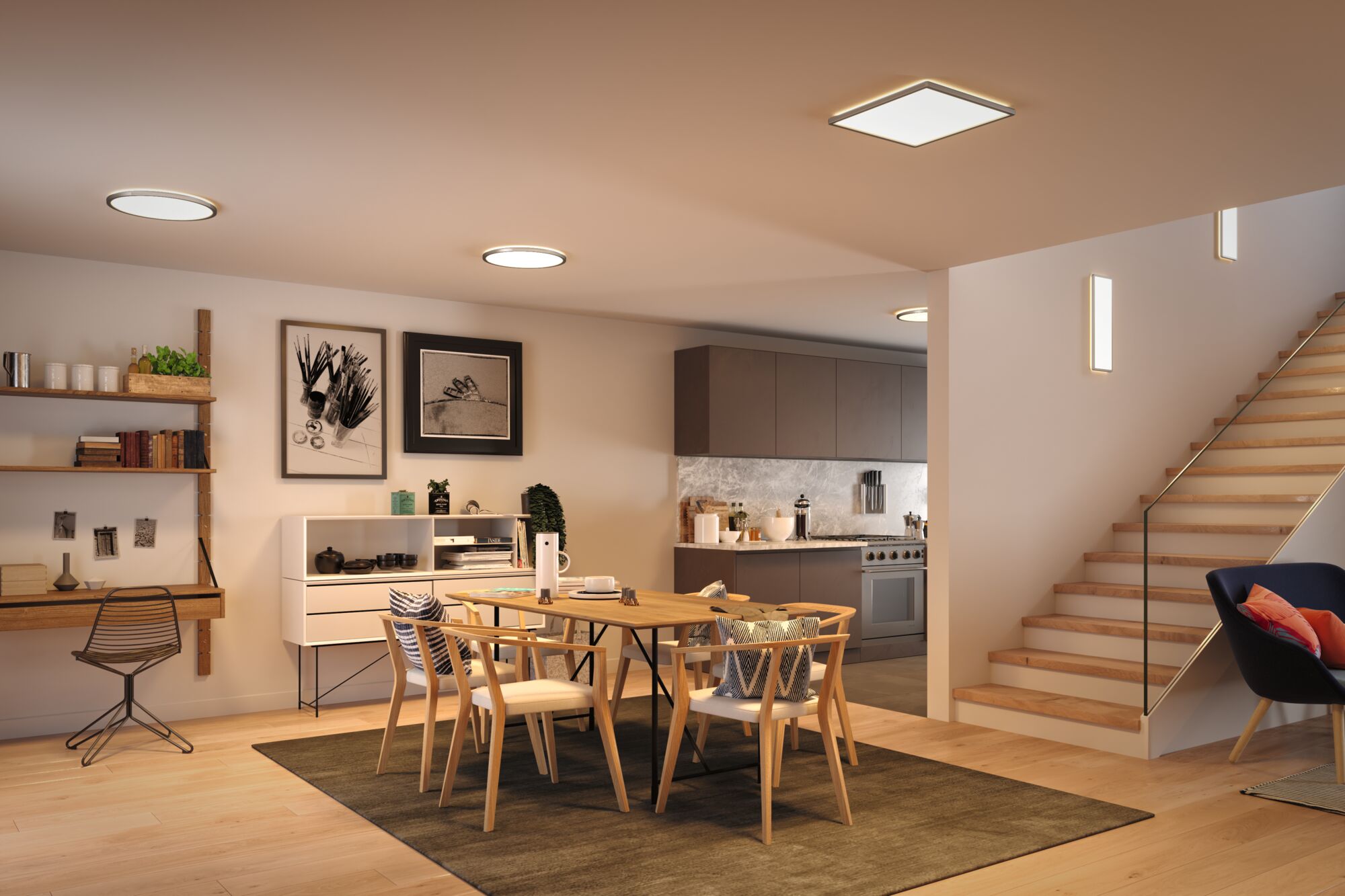 Modern round and square LED ceiling lights with warm white light in open kitchen dining area with wooden furniture