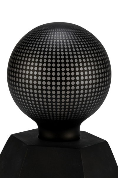 Black metal sphere with dotted pattern on hexagonal base, modern LED decorative light