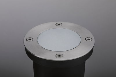 Round stainless steel recessed spotlight with frosted glass cover and screws for outdoor lighting.
