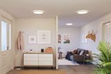 Modern living room with round ceiling lights emitting warm white light and minimalist decor