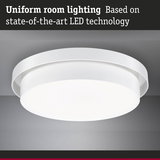 Round white LED ceiling light made of plastic for uniform room lighting with modern technology
