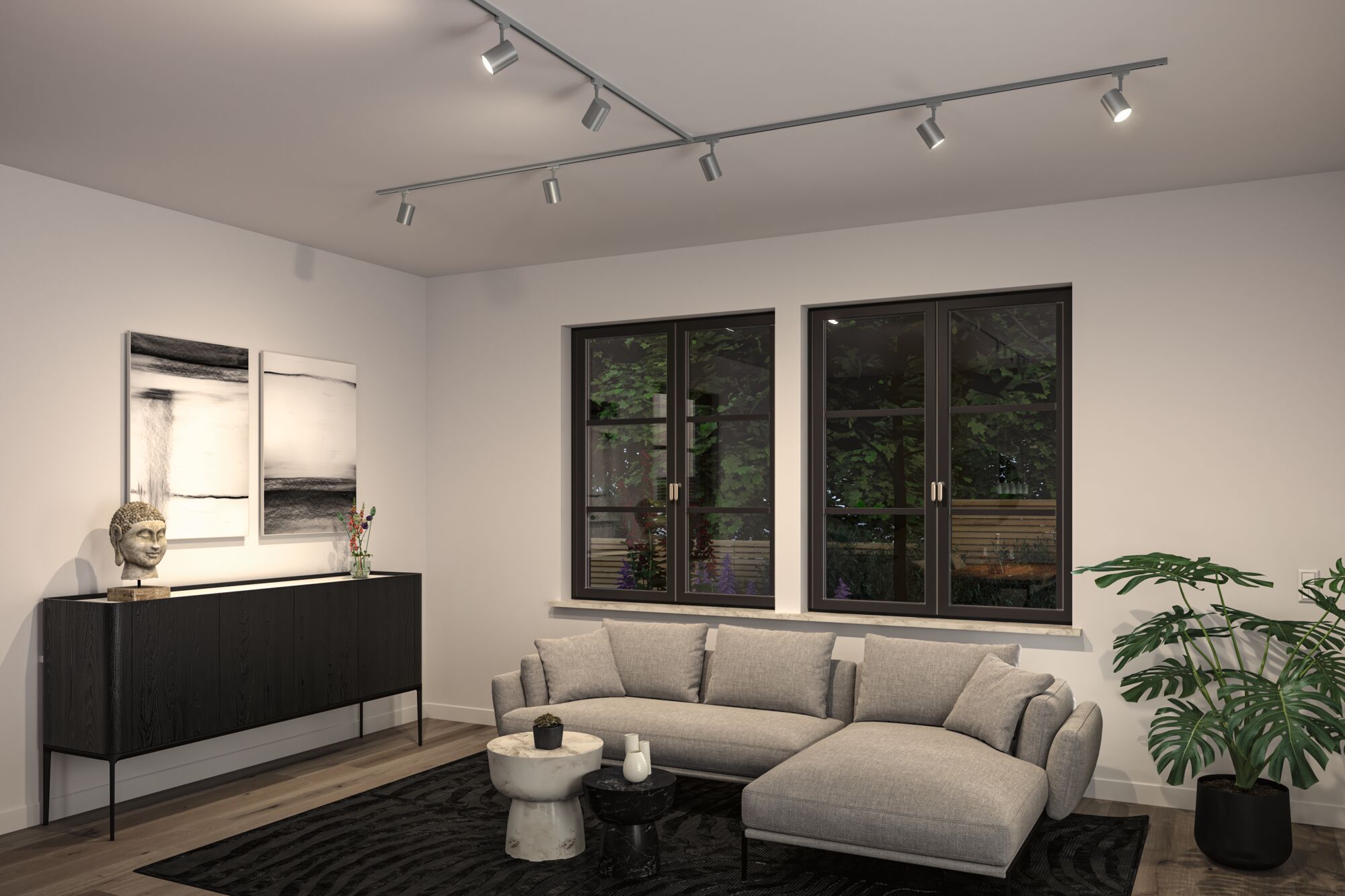 Modernes Wohnzimmer mit grauem Stoffsofa, schwarzem Sideboard und verstellbaren Deckenstrahlern aus Metall.