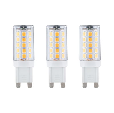 Three white LED bulbs with transparent casing and warm white diodes for energy-efficient lighting