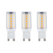 Three white LED bulbs with transparent casing and warm white diodes for energy-efficient lighting