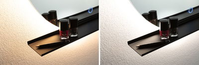 Black wall shelf with LED mirror light, nail polish bottles and eyeliner pencil on textured wall.