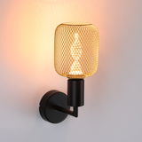 Black wall lamp with gold metal mesh and warm white LED bulb for atmospheric lighting in modern interiors