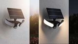Black solar outdoor light with motion sensor and two white LED panels mounted on wall, shown day and night