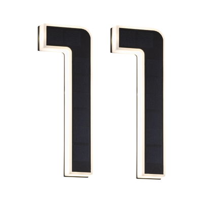 Two black L-shaped solar lights with white LED frame for energy-saving outdoor lighting