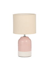 Table lamp with pink ceramic base and beige fabric shade for cozy home lighting