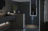 Moderne badkamer met donkere tegels en LED-lichtstrips voor sfeerverlichting