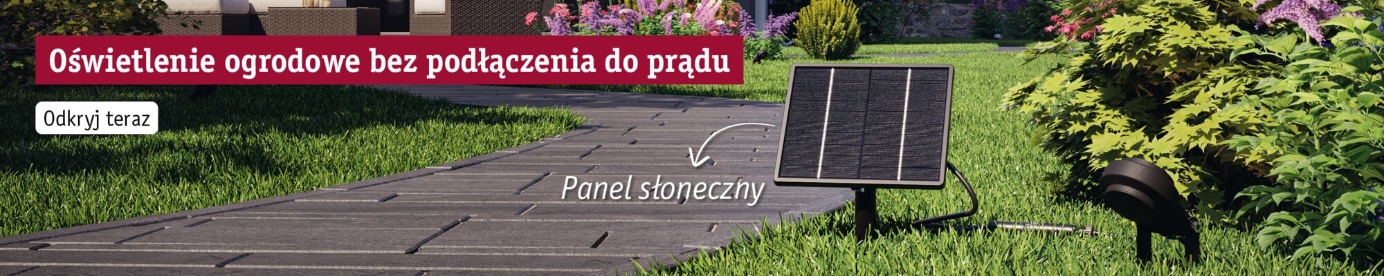 Solar panel in garden by path with green grass and bushes for power-free outdoor lighting