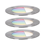 Three round stainless steel recessed lights with colored glass and white light for outdoor lighting