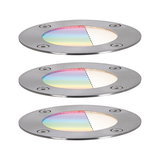 Three round stainless steel recessed lights with colored glass and white light for outdoor lighting