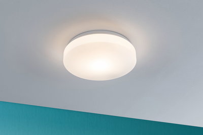 Round ceiling light with white plastic shade and warm white light for living spaces.