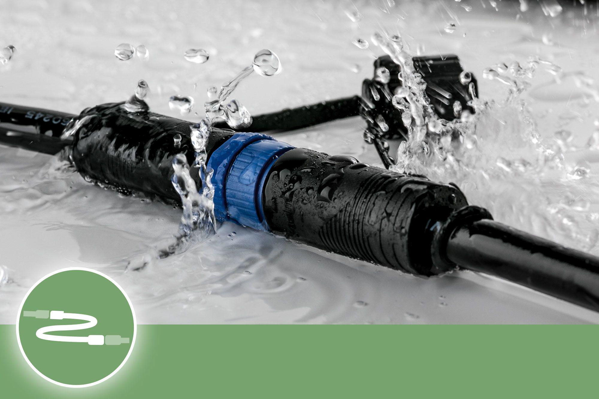 Waterproof black outdoor connector with blue ring, durable cable for exterior lighting solutions