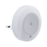 Round white night light with plug and sensor for energy-saving LED indoor lighting