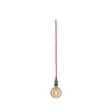 Hanging light bulb with red cable and warm glow for modern lighting design