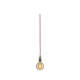 Hanging light bulb with red cable and warm glow for modern lighting design