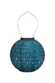 Round blue metal lantern with perforated pattern and metal handle for ambient lighting.