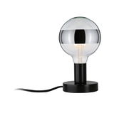 Modern table lamp with black metal base and large glass globe featuring silver band, LED lighting
