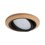 Round recessed light housing in light wood with black LED spotlight for modern indoor lighting