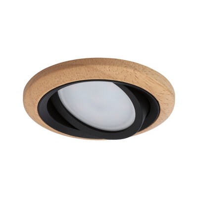 Round recessed light housing in light wood with black LED spotlight for modern indoor lighting
