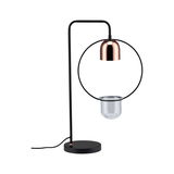 Moderne zwarte metalen tafellamp met koperen kap en helder glazen houder voor stijlvolle verlichting