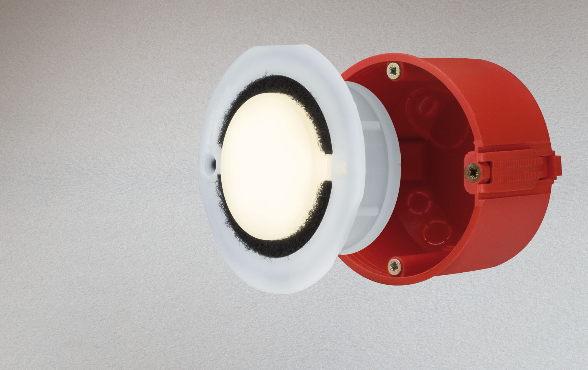 Red plastic mounting box with white LED recessed spotlight and black sealing ring for lighting
