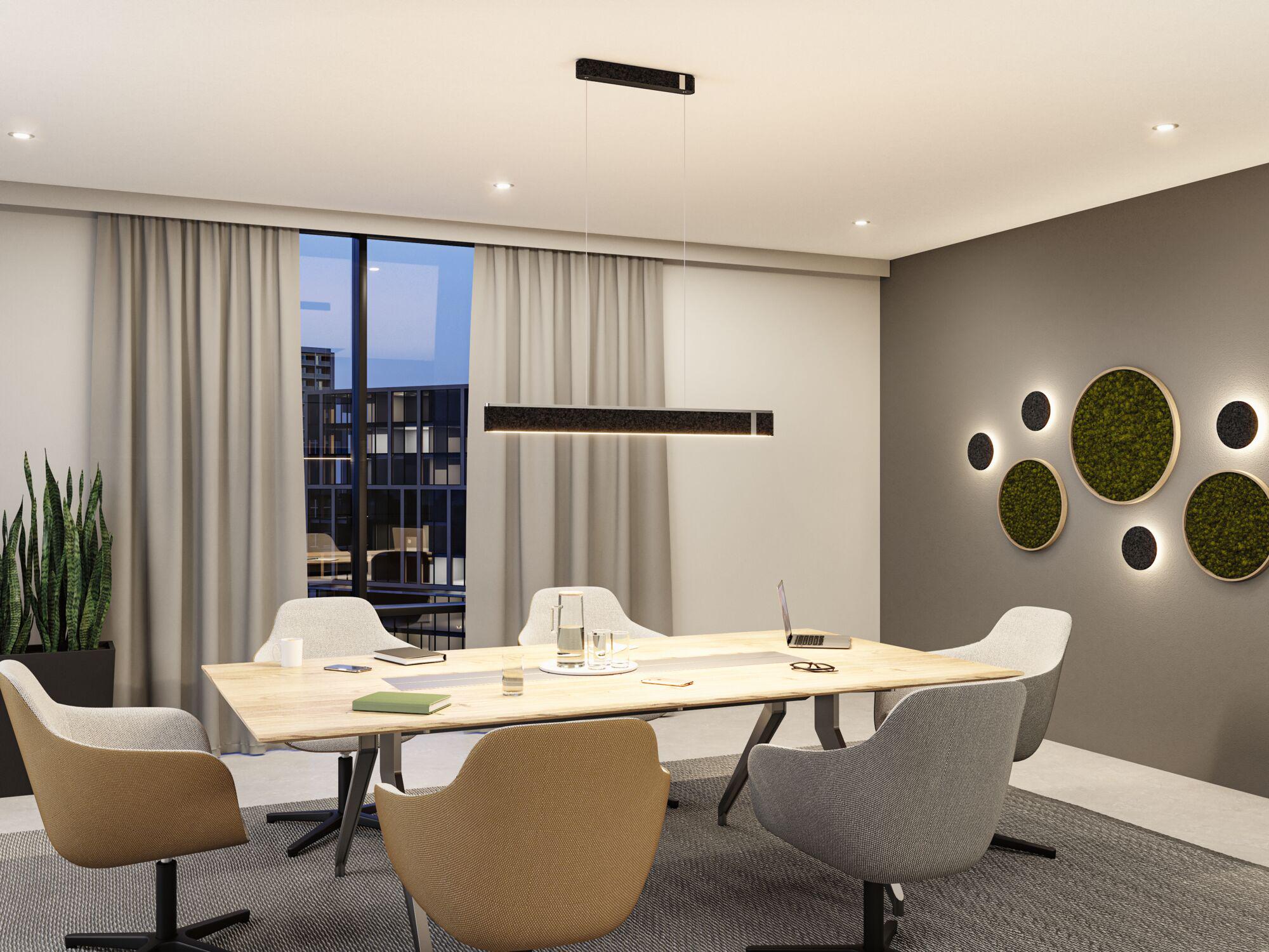 Modern office with light wood table, grey and brown fabric chairs, and black LED pendant light