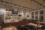 Modern café interior with wooden counter, white tiles, and warm LED pendant lights for cozy lighting.