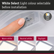 Finger selects white light colour before installation showing warm white, neutral white and daylight LED