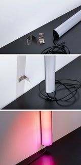 Moderne LED-wandlamp met zwarte behuizing en witte diffuser, inclusief roestvrijstalen beugels en kabel.