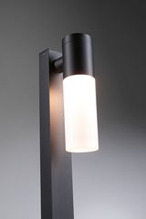 Modern black metal outdoor wall light with white glass and LED lighting for garden and terrace