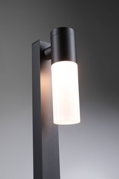 Modern black metal outdoor wall light with white glass and LED lighting for garden and terrace