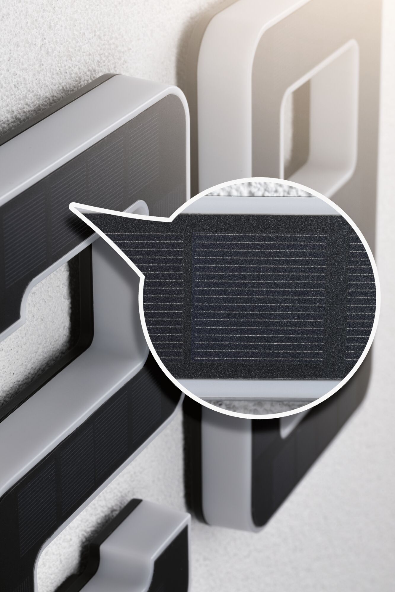 Close-up of grey plastic frame with black solar panel for energy-saving lighting solutions